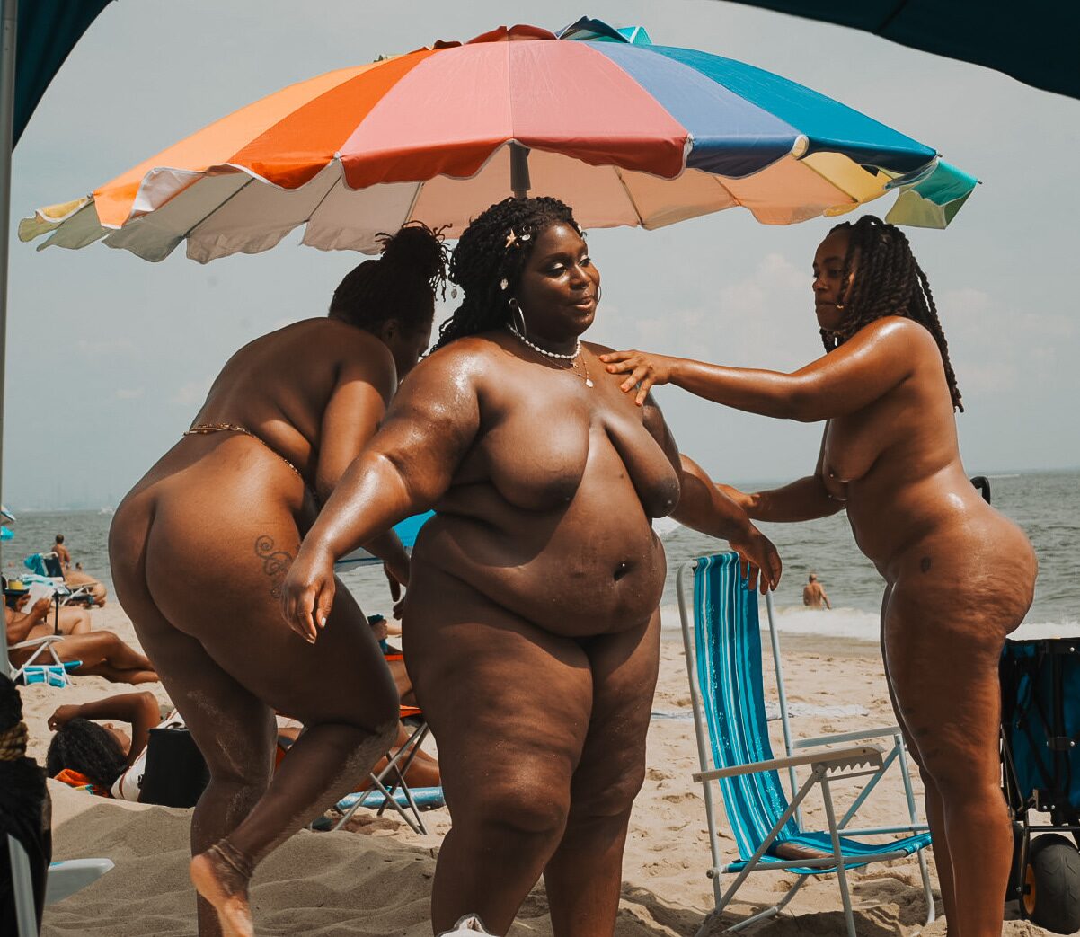 Arriving on the sand under a beach umbrella.