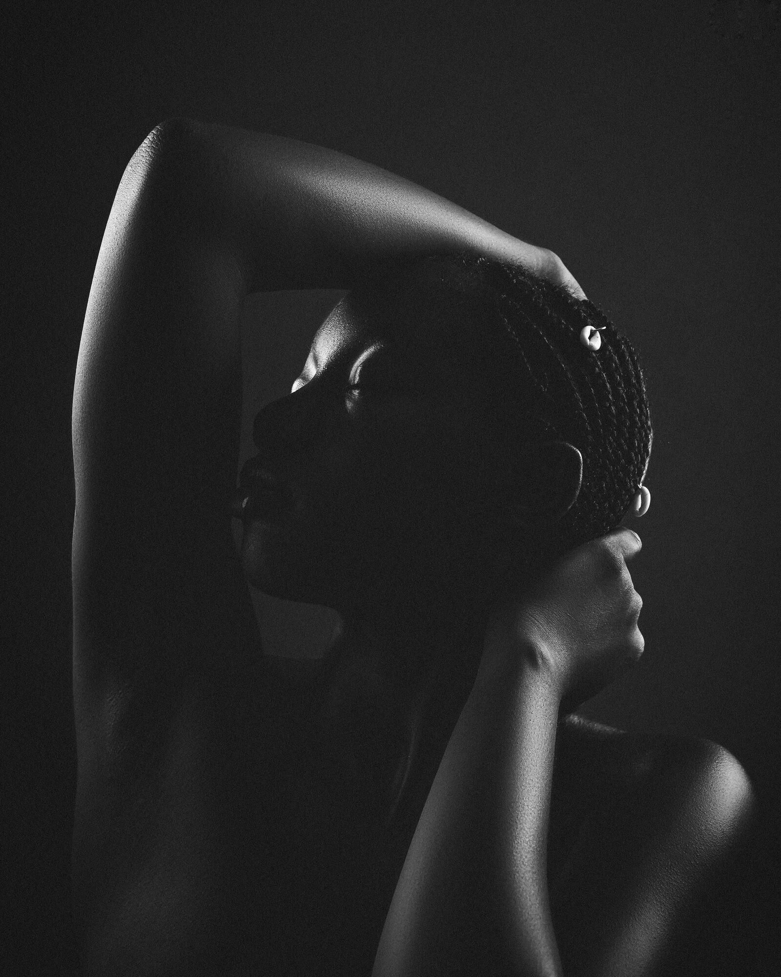 Mood still: a taut arm in black and white.