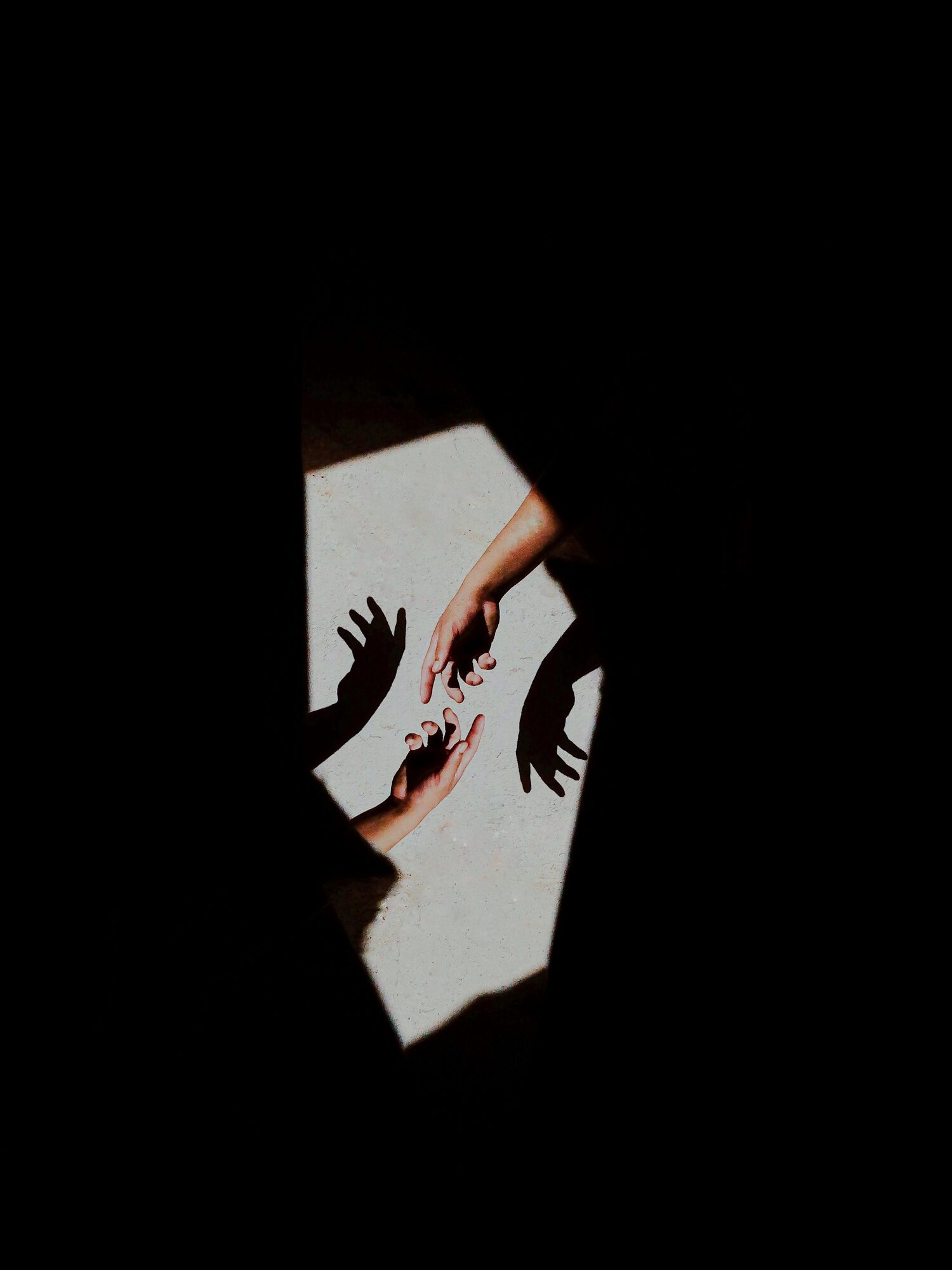 Gold light falling across an open, resting hand.