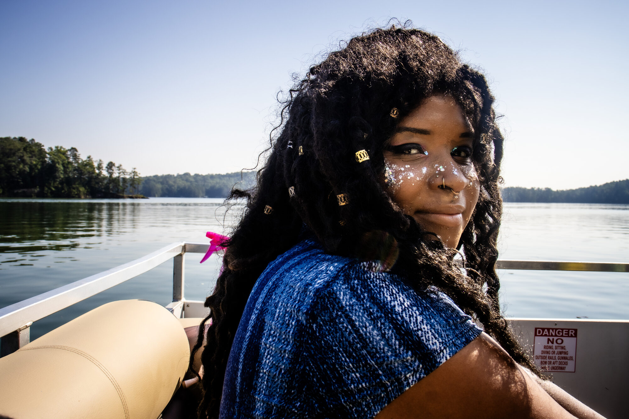 A woman looks back across Lake Allatoona as the day begins